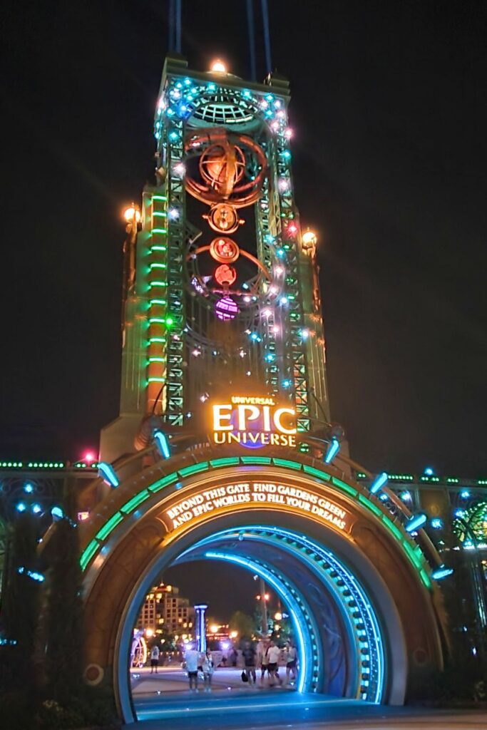 Epic Universe entrance lit up at night